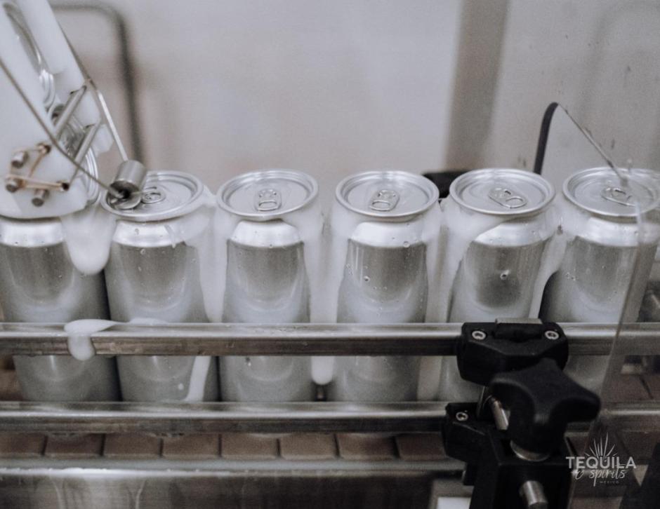 Detail of cans being filled with a tequila ready to drink cocktail at Tequila and Spirits Mexico