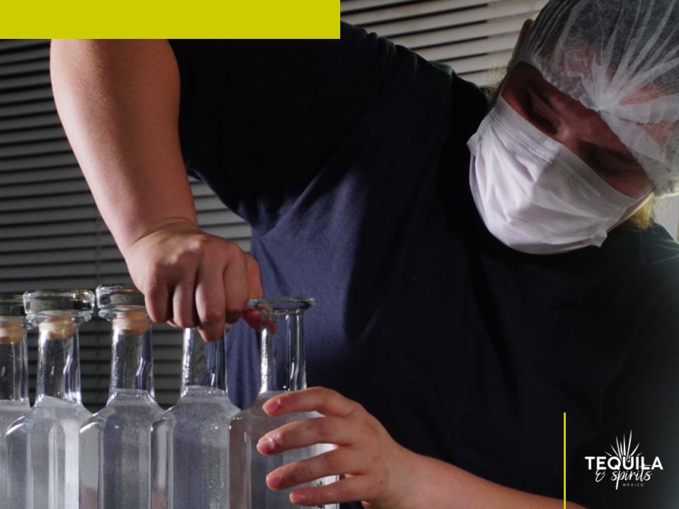 A woman bottling a tequila private brand at Tequila Spirits Mexico distillery