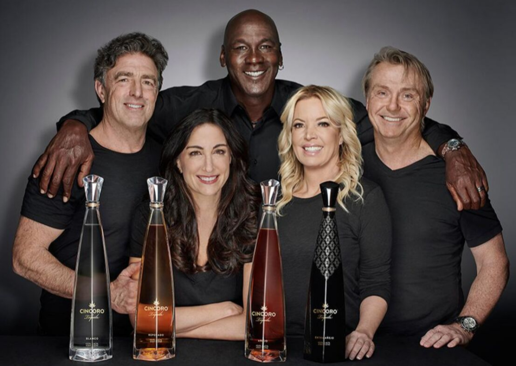 Michael Jordan appears with other four people, showing his tequila brand, Cincoro